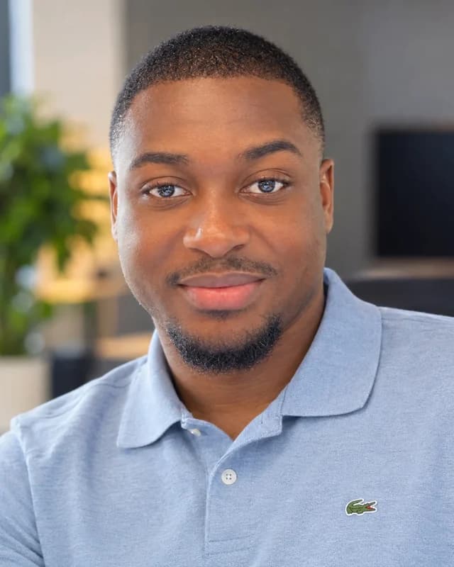 Head-and-shoulders photo of Ebenezer Osei-Bonsu smiling, in a light-blue polo shirt.